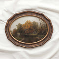 Cottagecore cabin decor printable fall wall art showing an oak tree forest and cabin scene.