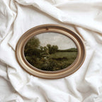 Green landscape print styled as timeless wall art for a collected country home interior