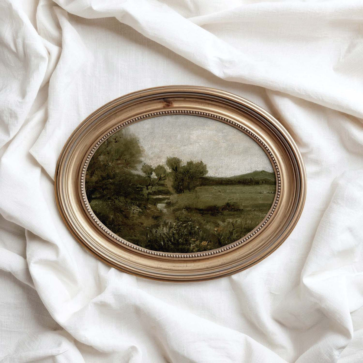 Green landscape print styled as timeless wall art for a collected country home interior