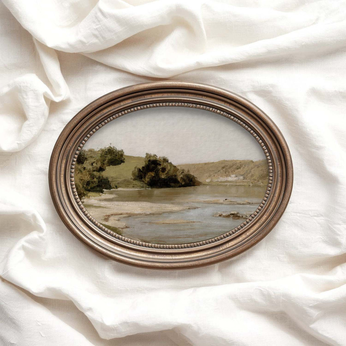 Neutral river landscape artwork in olive, beige and muted gold tones styled as living room wall art