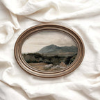 Vintage Western wall art featuring a rugged mountain landscape in muted natural tones